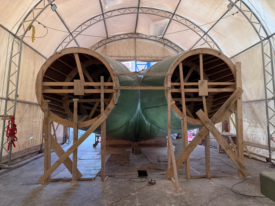 Wooden mold and support structure during fabrication of the pants duct.