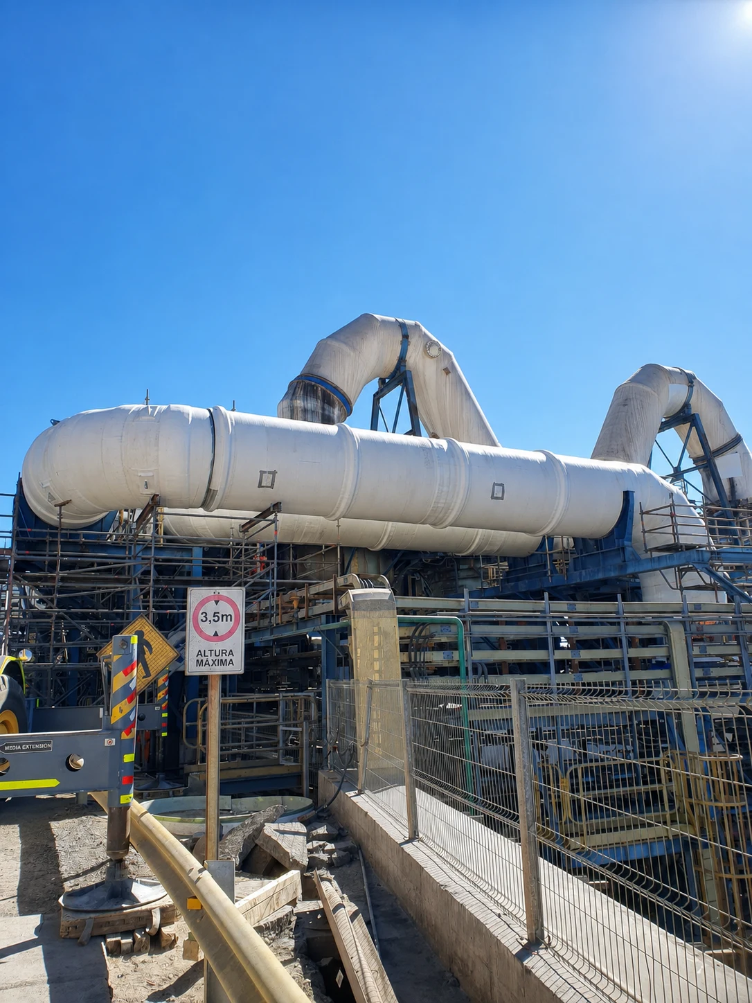 Operator working on the installation of an industrial component.
